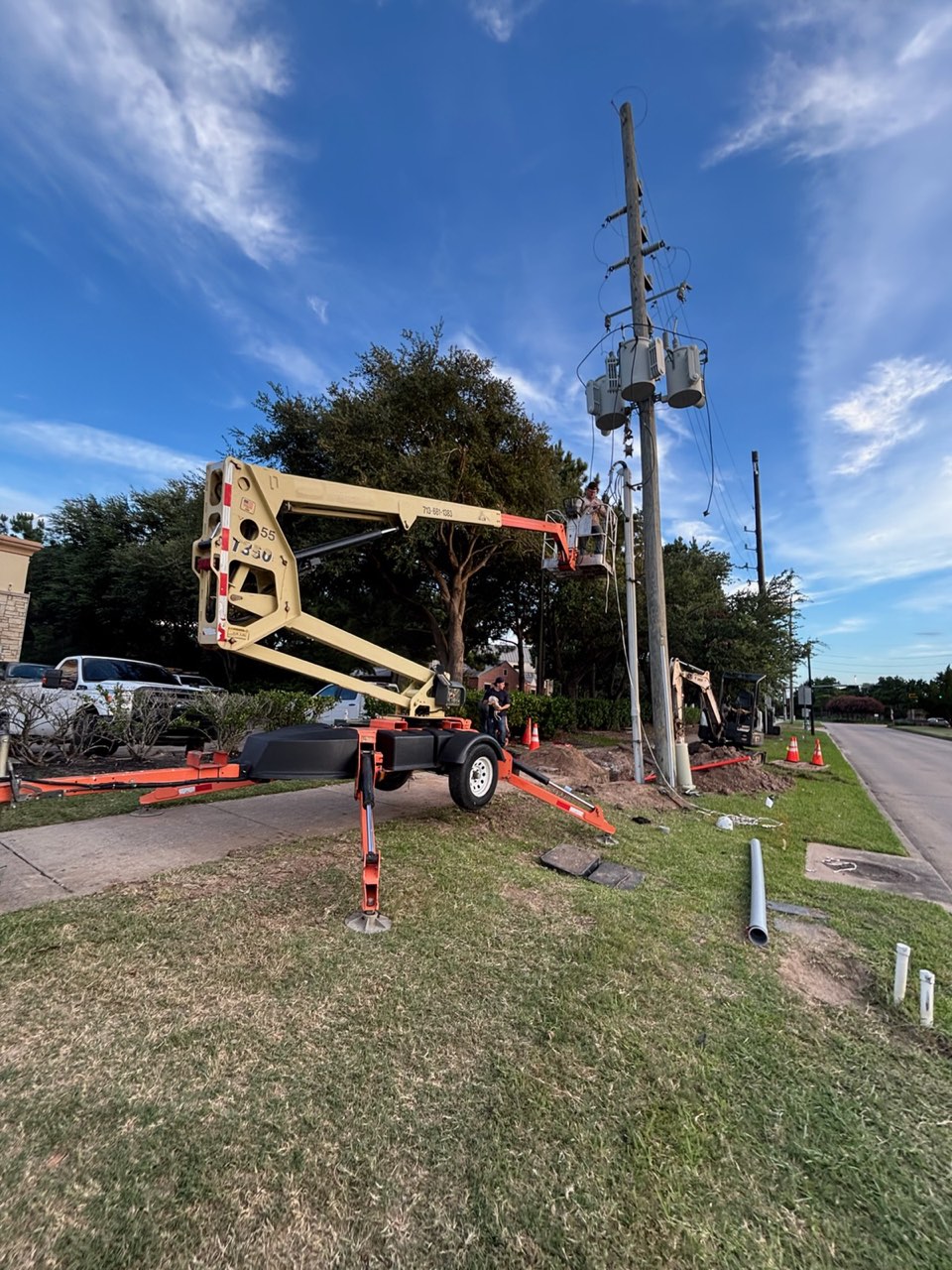 VCG Electrical crew on a commercial service job in Houston with bucket-truck access