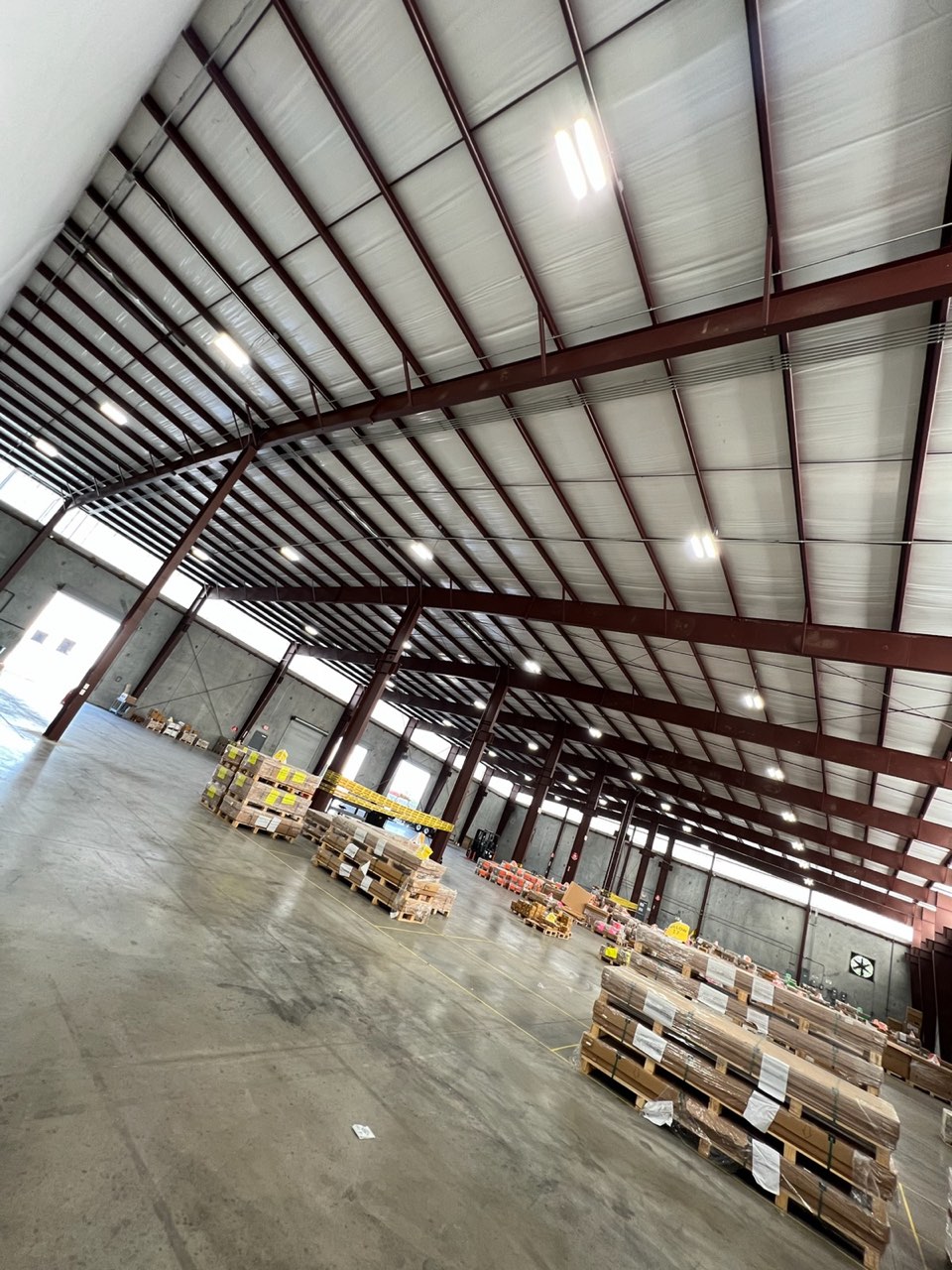Warehouse high-bay lighting and structural steel in Houston