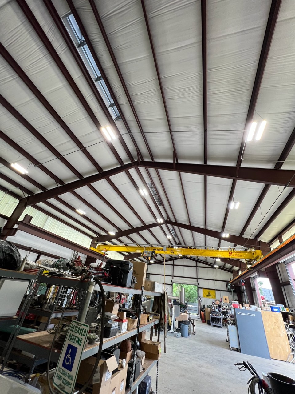 Warehouse ceiling lighting and conduit run by VCG Electrical