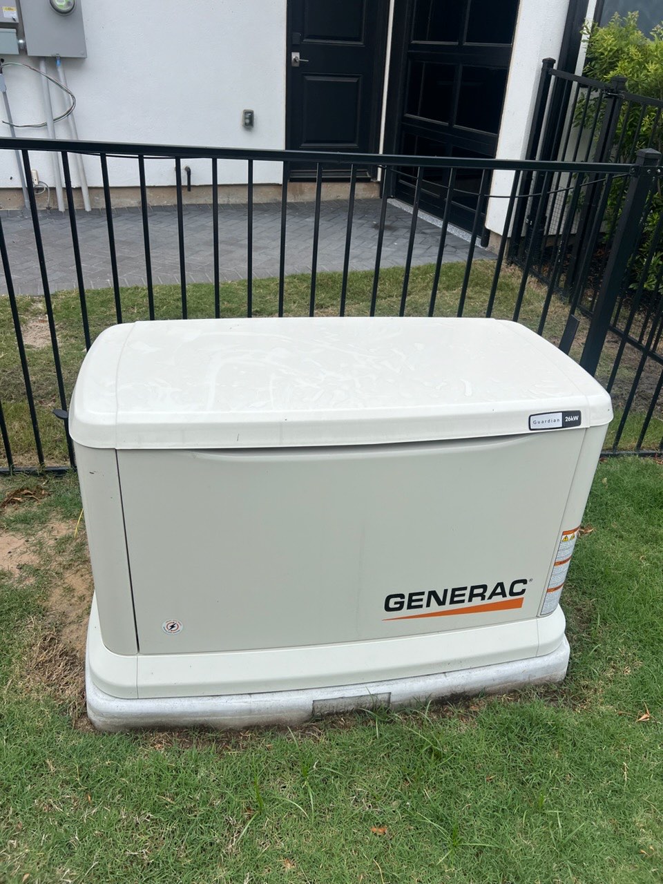 Standby generator installed beside a Houston home
