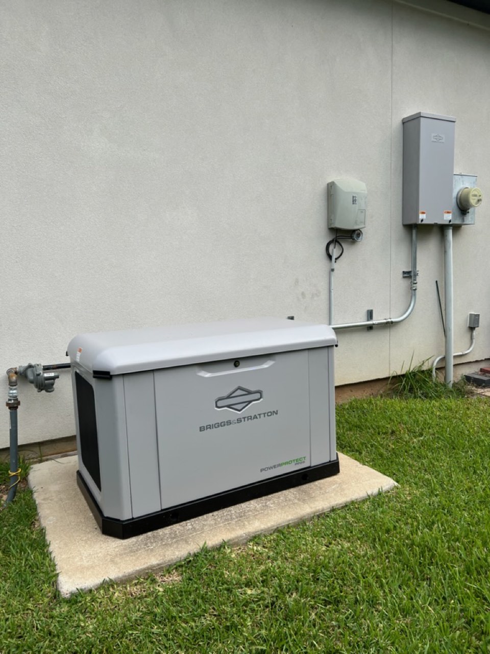 Generac standby generator on a concrete pad in Houston