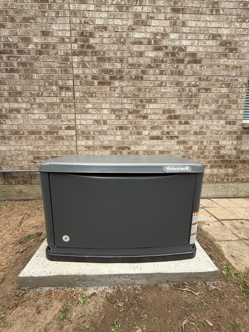 Whole-home standby generator beside a Houston residence