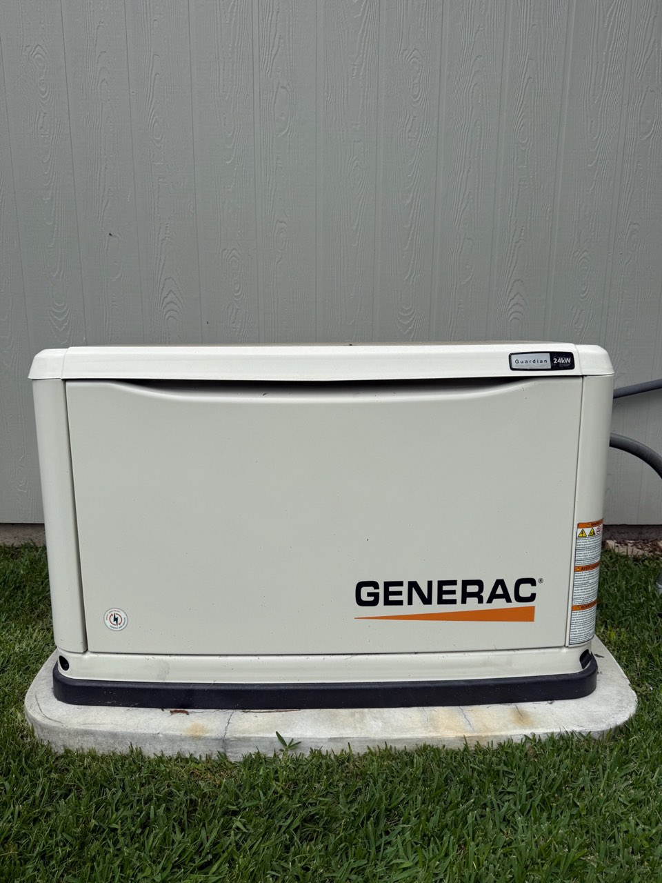 Briggs and Stratton standby generator beside a home